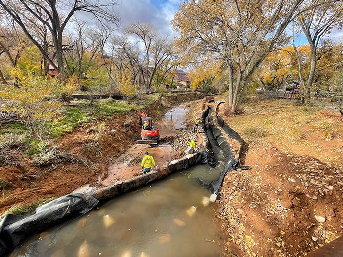 Crews put riprap in place along the banks and streambed of Mill Creek to help stabilize the channel 